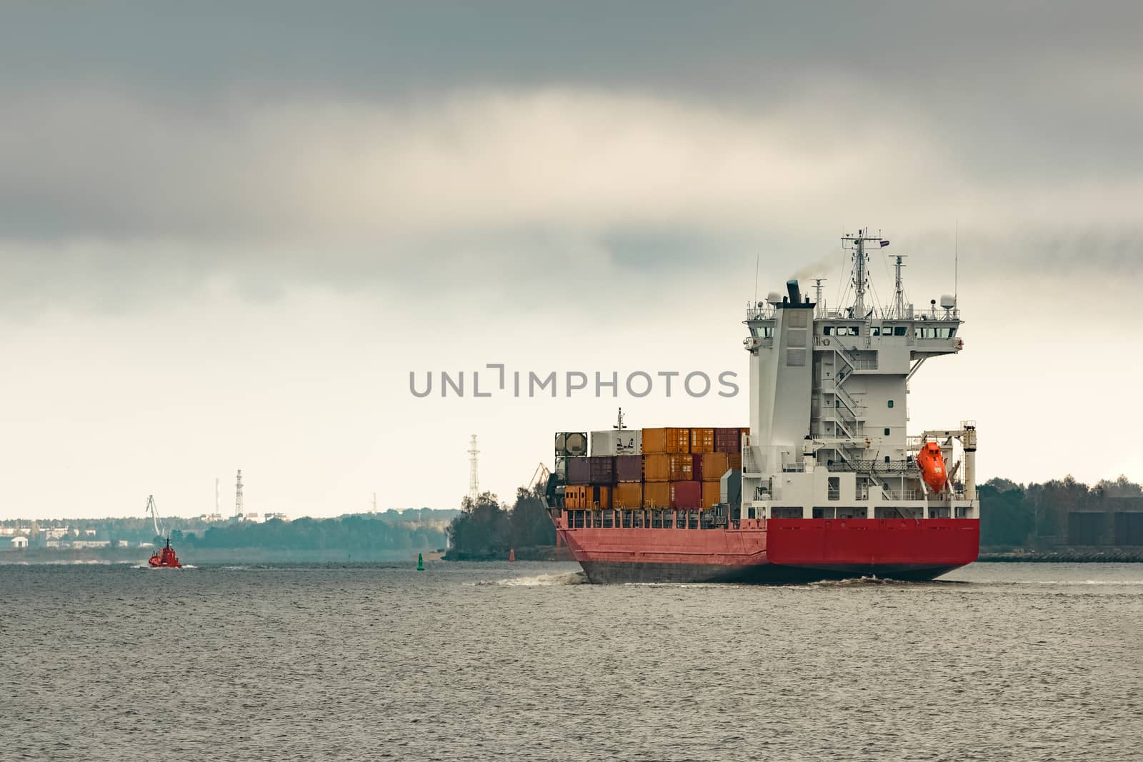 Red cargo container ship by sengnsp