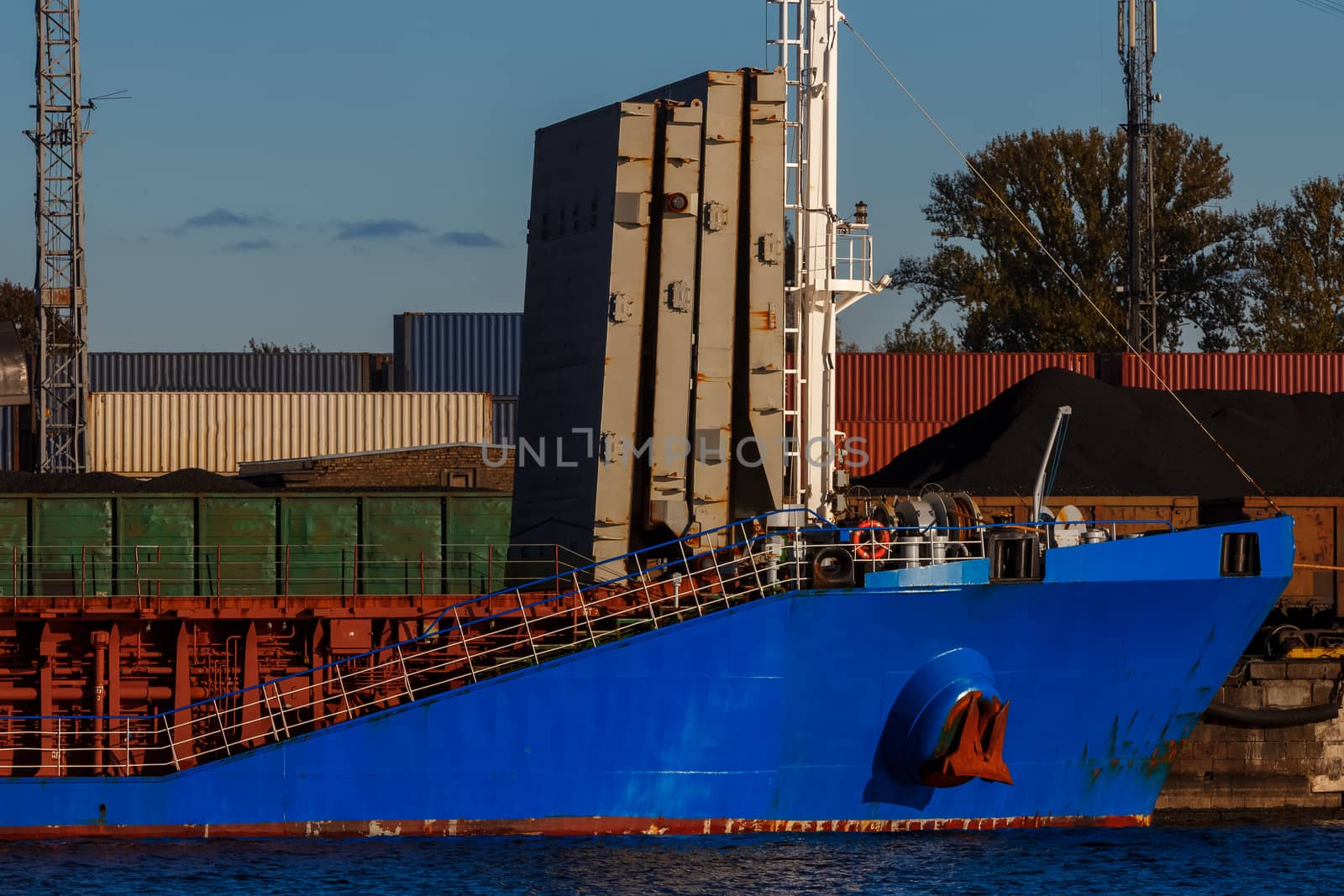 Blue cargo ship loading by sengnsp