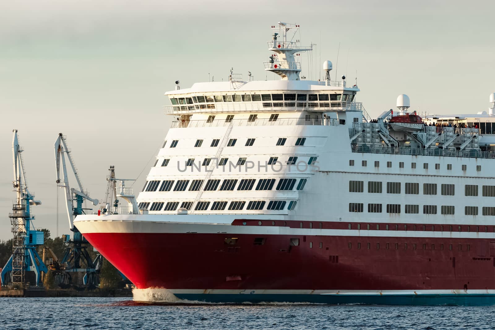 Red cruise liner's bow. Passenger ferry underway close up