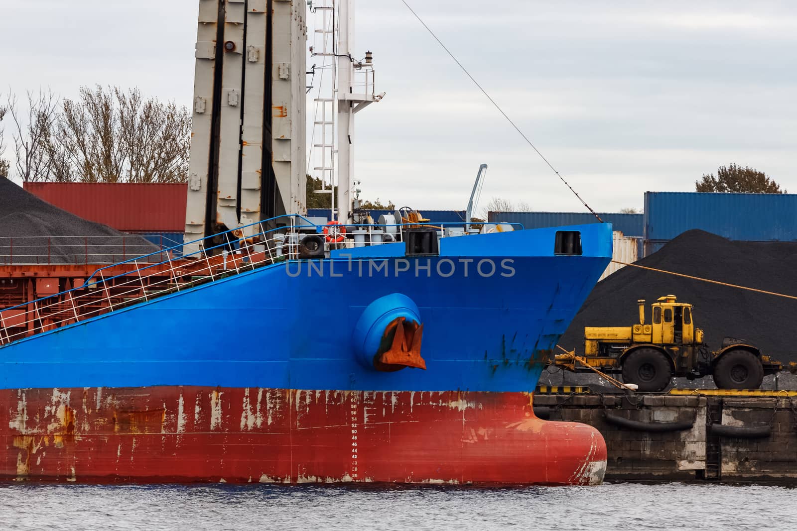 Blue cargo ship loading by sengnsp