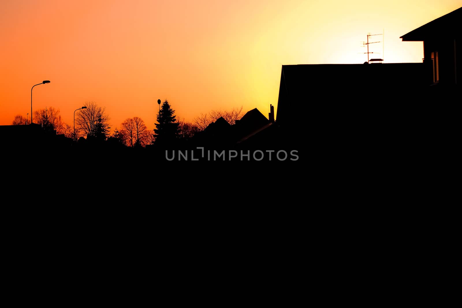 Evening townscape silhouette against the sunset sky