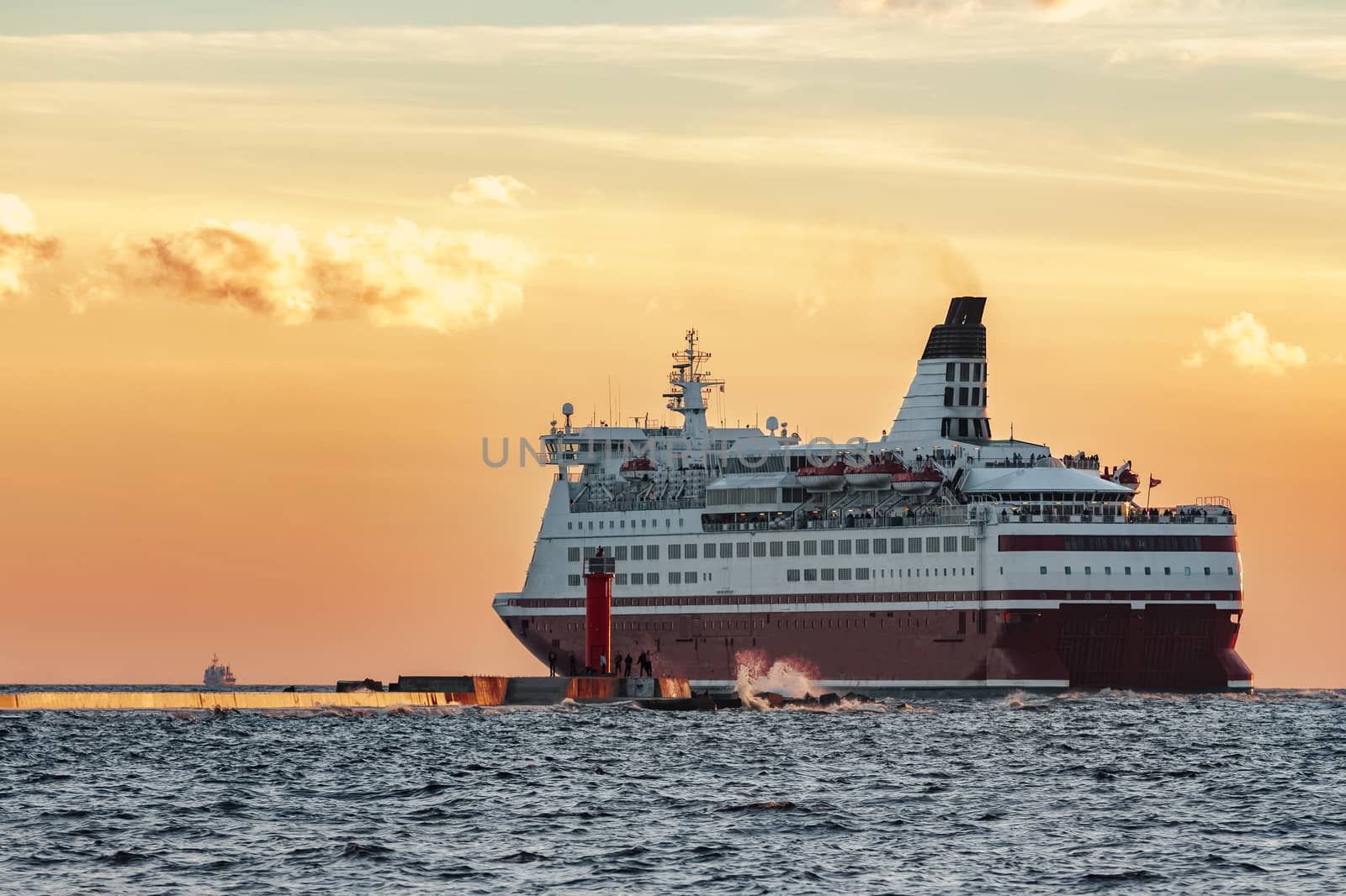 Red cruise liner. Passenger ferry sailing from Riga to Stockholm