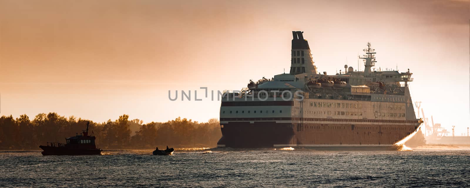 Big cruise liner. Passenger ferry ship entering Riga at morning