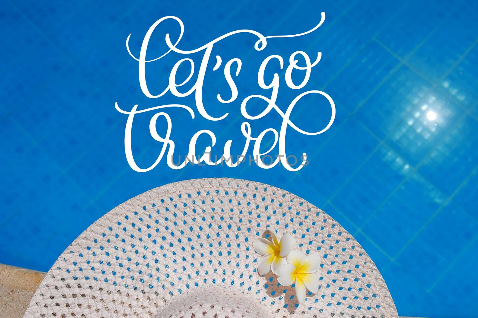 Big white hat on the edge of the pool and text Lets go travel. Calligraphy lettering hand draw by timonko