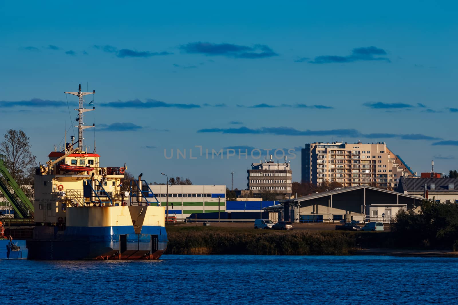 Blue cargo ship in the port of Riga, Europe