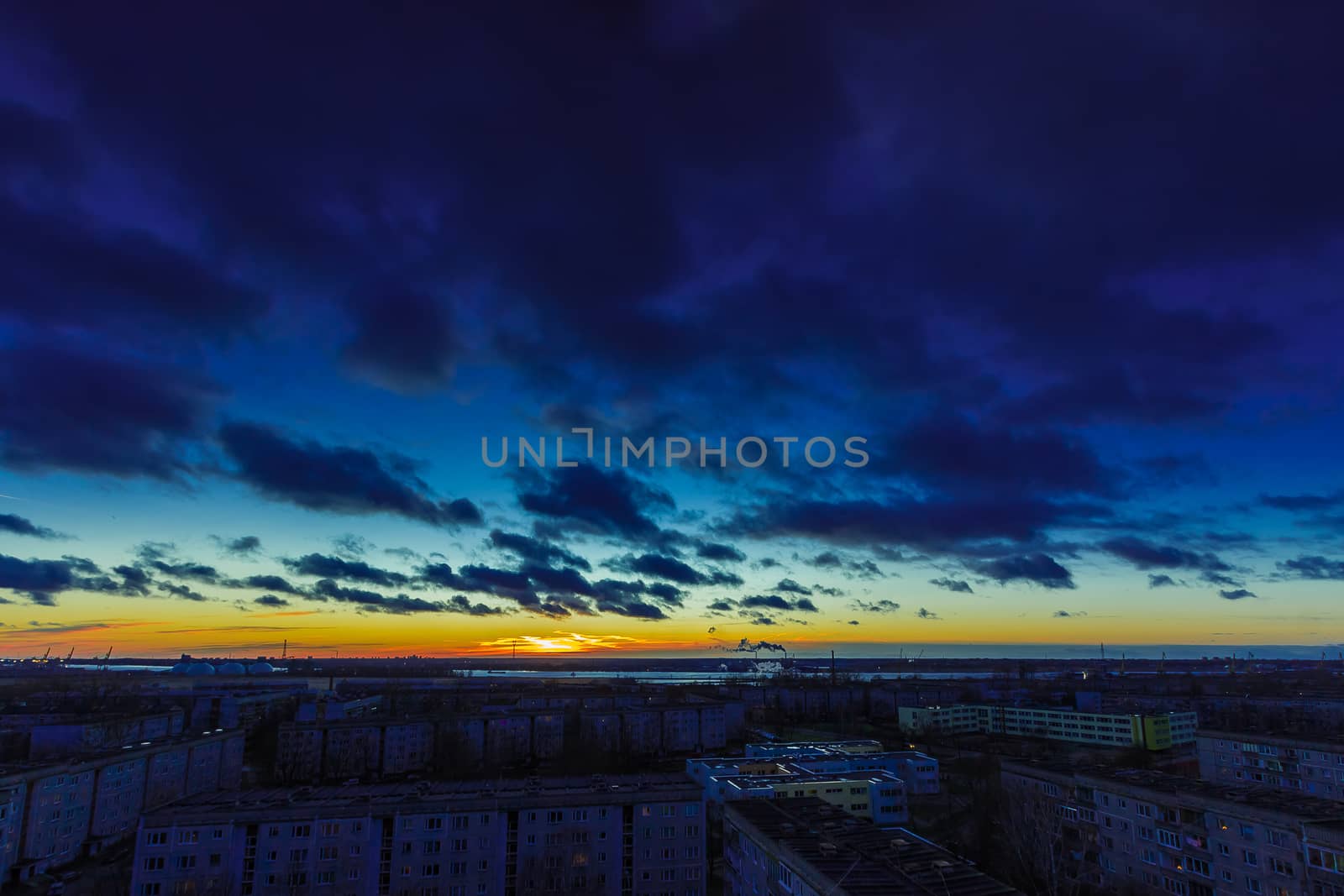 Evening cloudy sky and sunset in district of Riga, Latvia