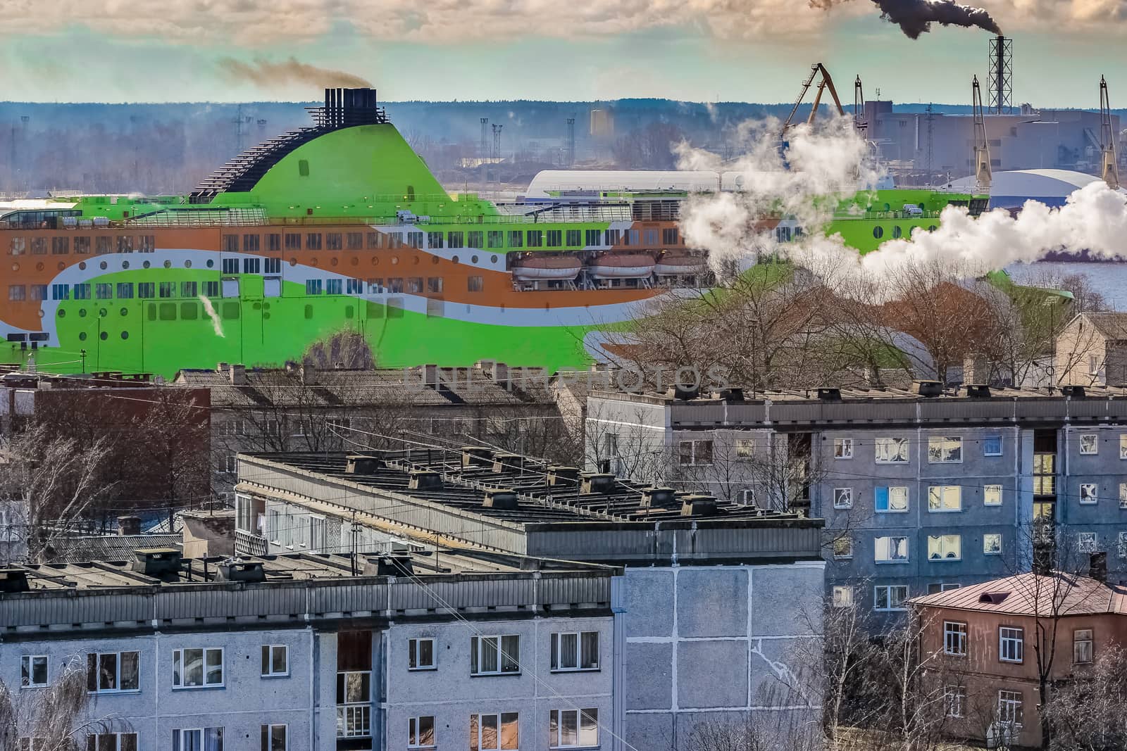 Green cruise liner. Passenger ferry sailing past the Riga city