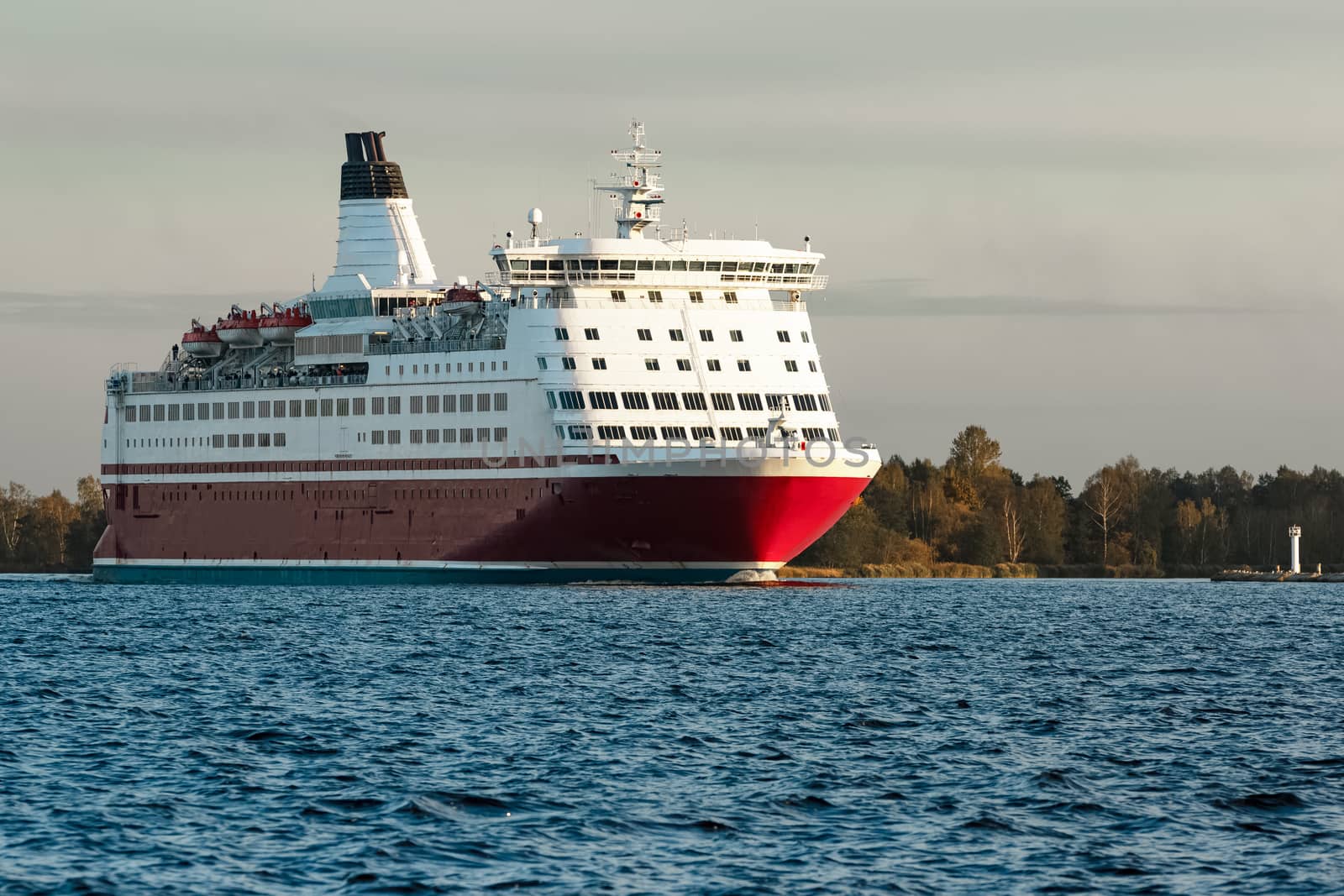 Red cruise liner. Passenger ferry sailing from Riga to Stockholm