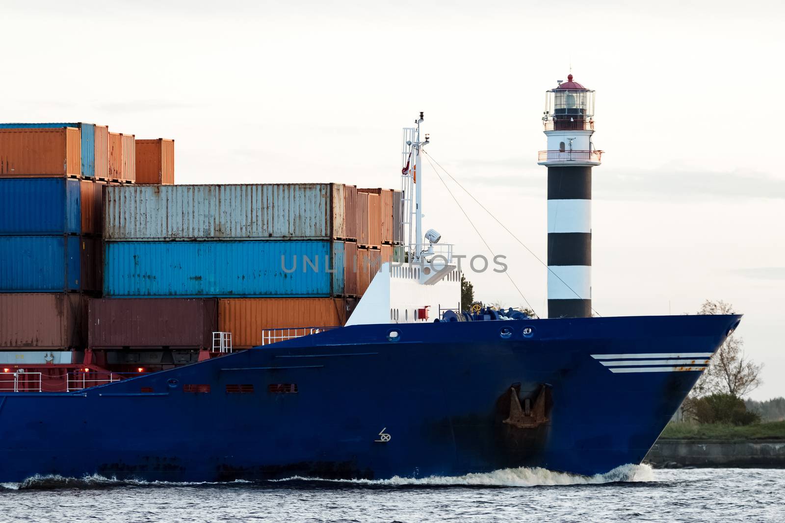 Blue container ship's bow by sengnsp