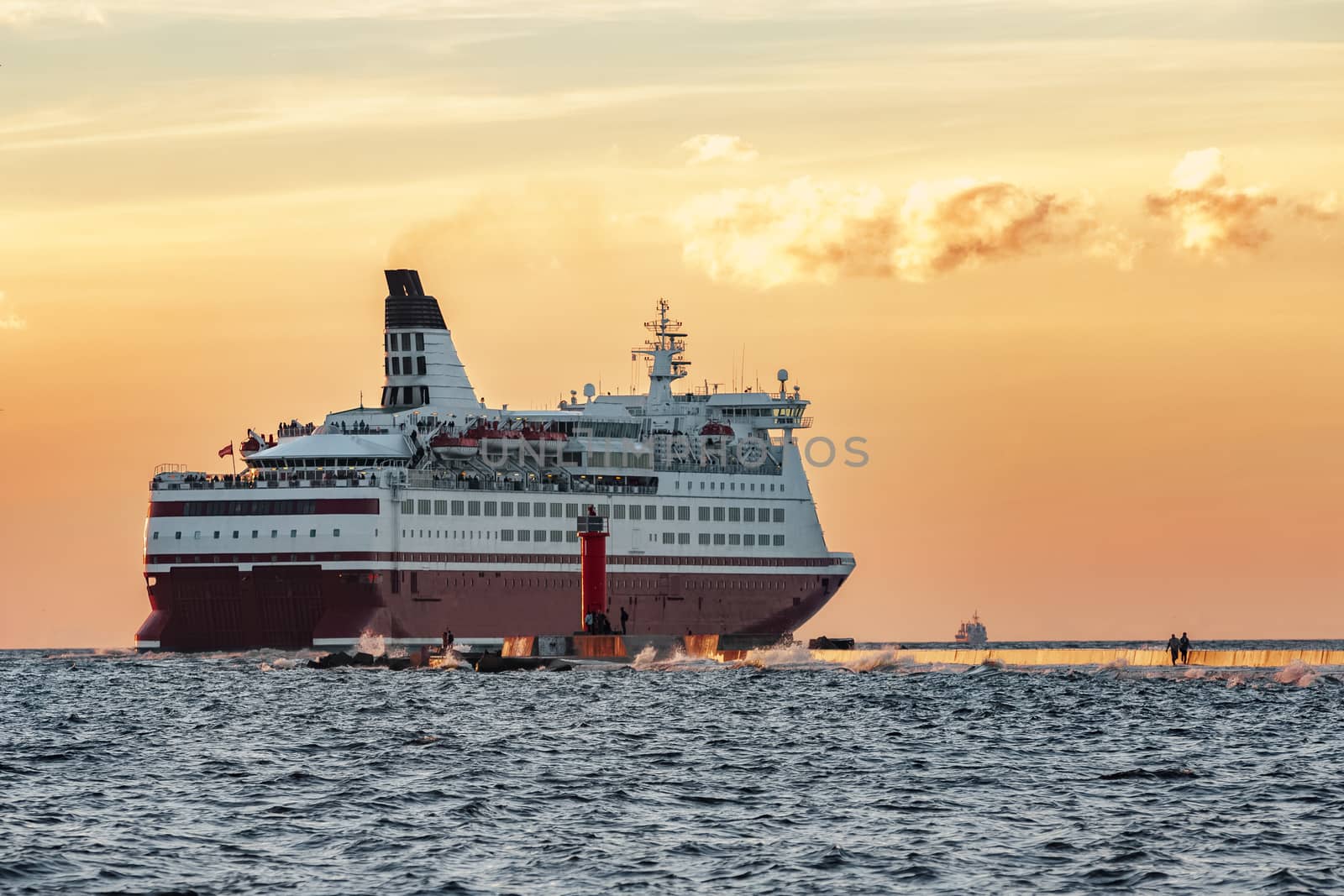 Red cruise liner. Passenger ferry sailing from Riga to Stockholm