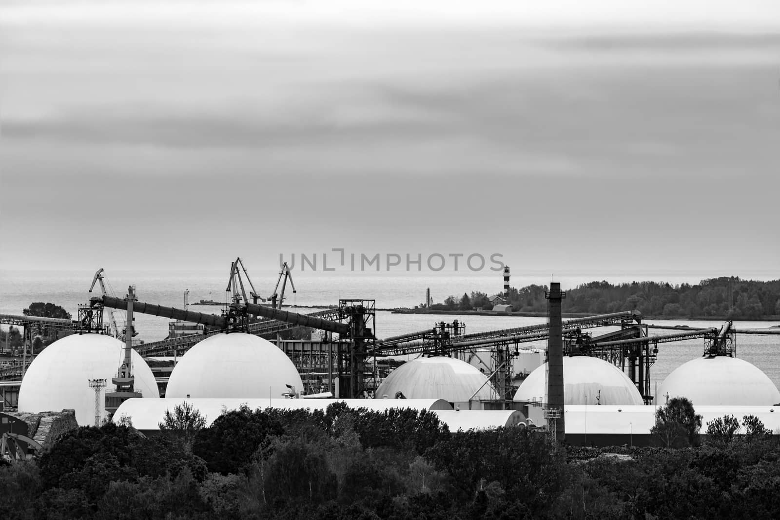 Fuel terminal in Riga, Latvia. Large oil tanks. Monochrome
