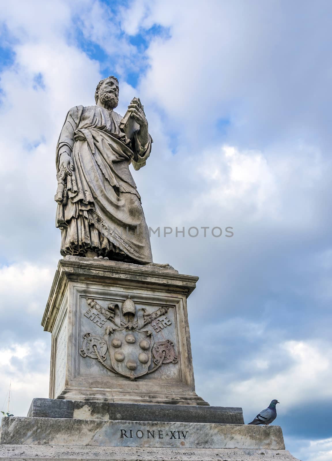 Statue of Apostle saint Peter on the Ponte Sant Angelo in Rome, Italy in a cloudy day