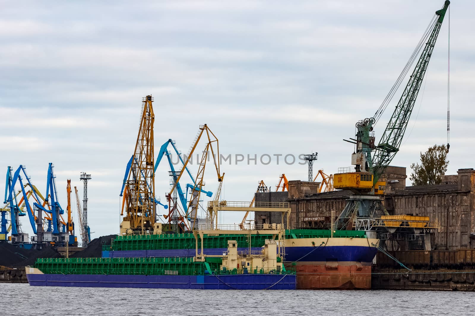 Blue cargo ship in the port of Riga, Europe