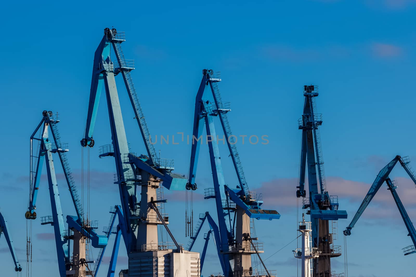 Blue cargo cranes in the port of Riga, Europe