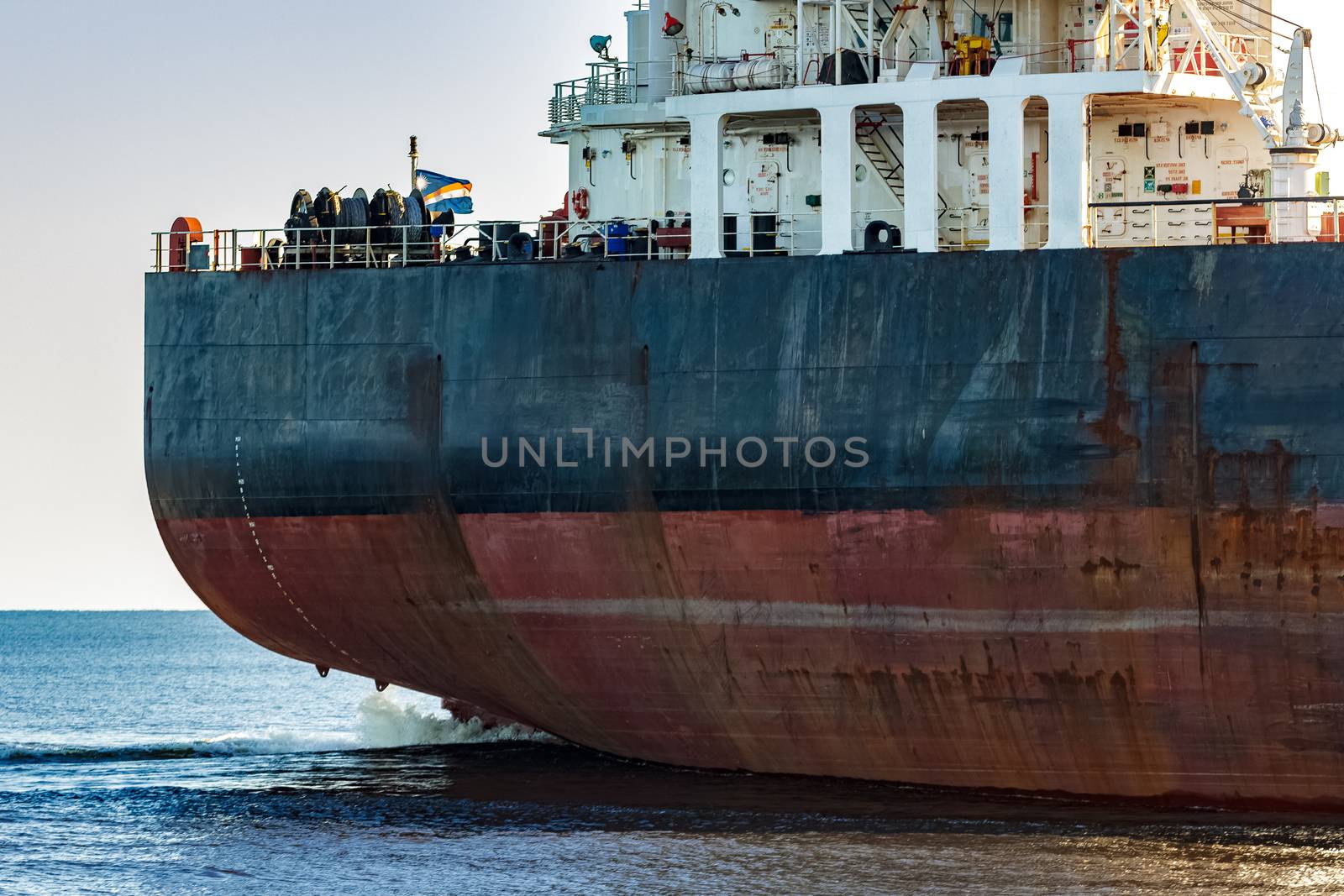 Black cargo ship's stern by sengnsp