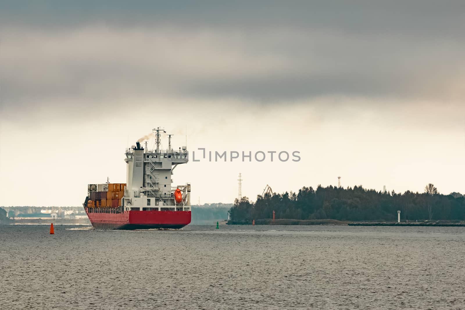 Red cargo container ship by sengnsp