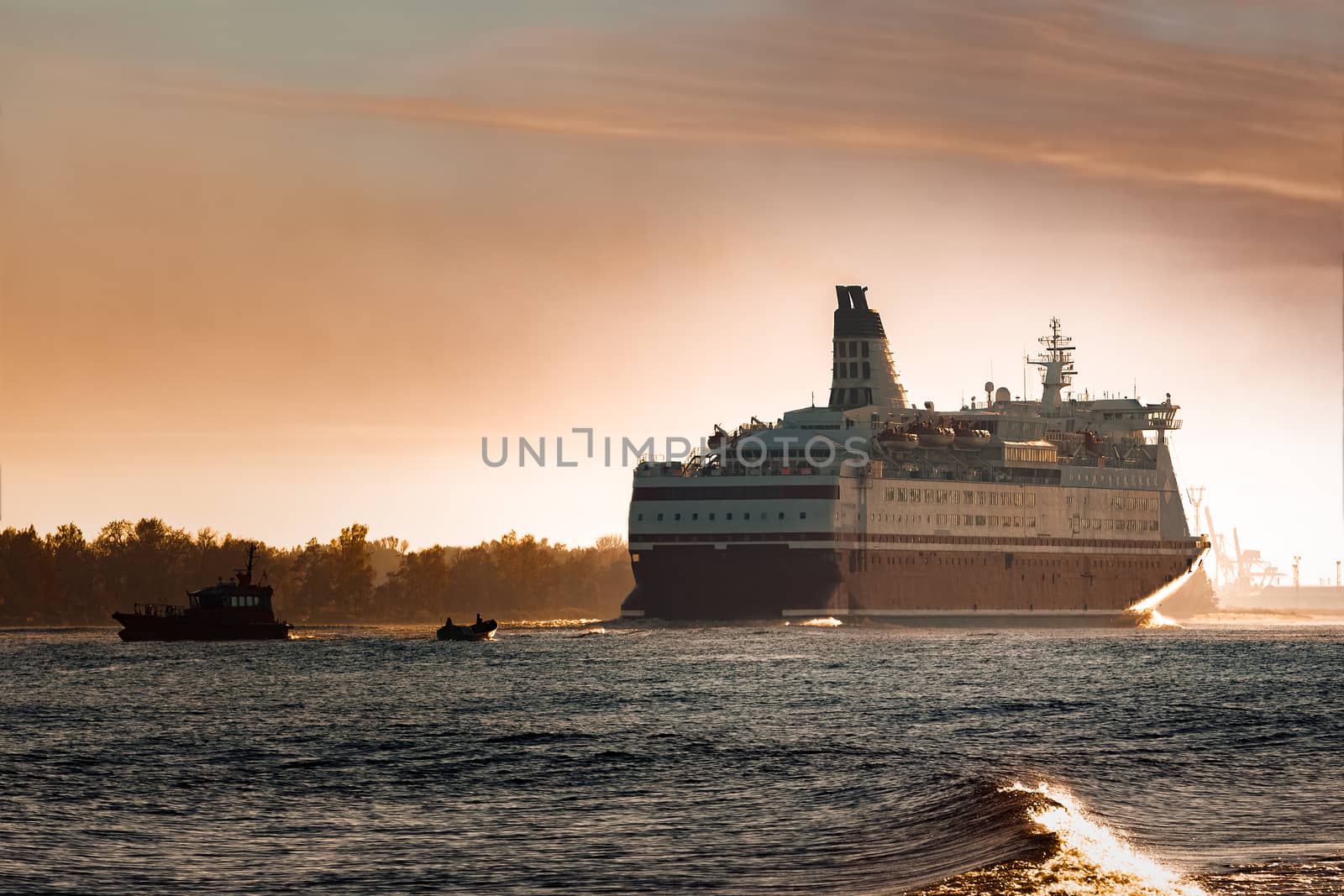 Big cruise liner. Passenger ferry ship entering Riga at morning