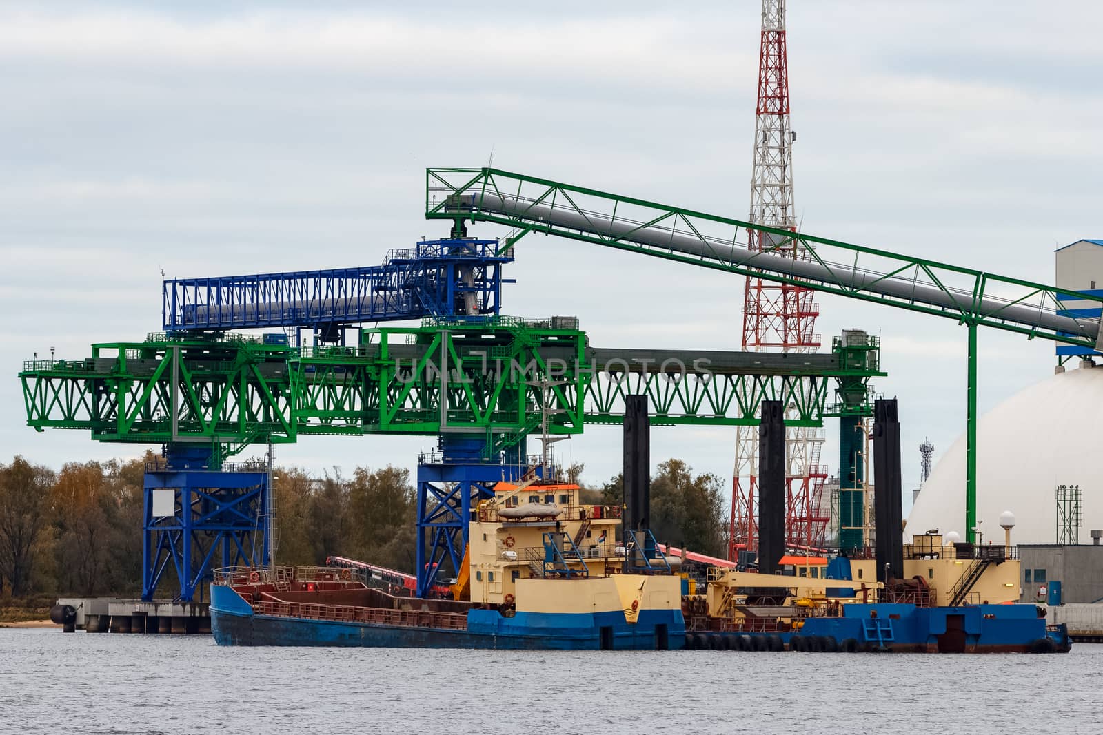 Blue cargo ship loading by sengnsp