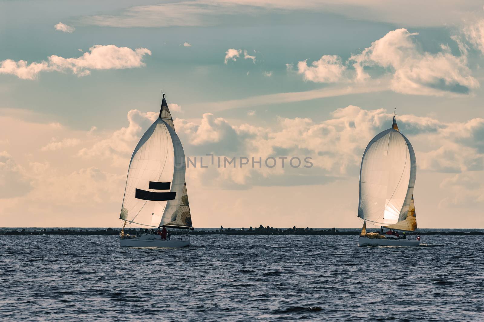 Sailboat regatta on Daugava river by sengnsp