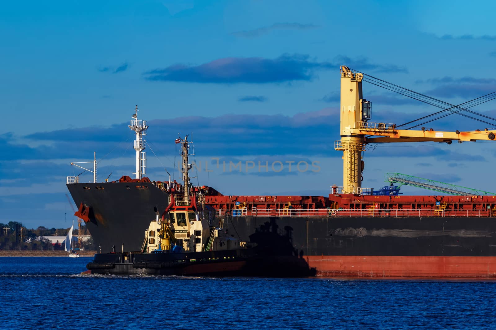 Black cargo ship mooring by sengnsp