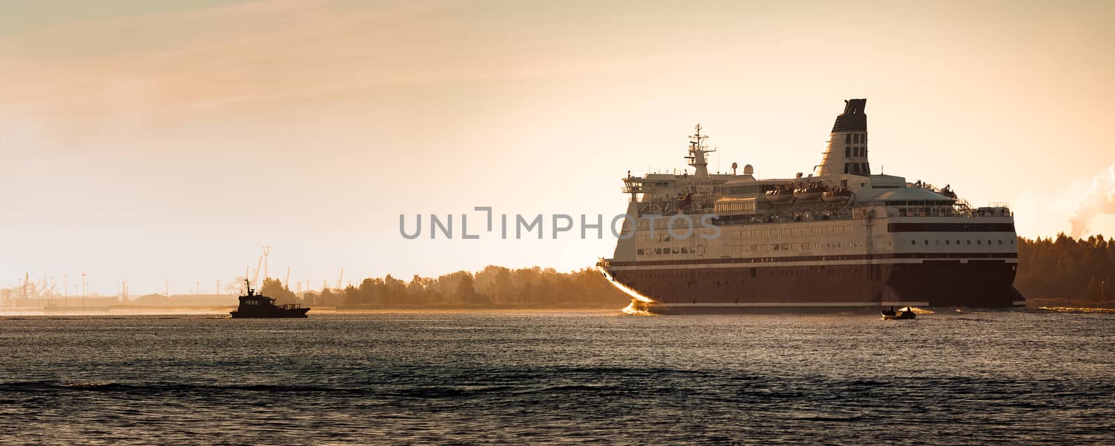 Big cruise liner. Passenger ferry ship entering Riga at morning