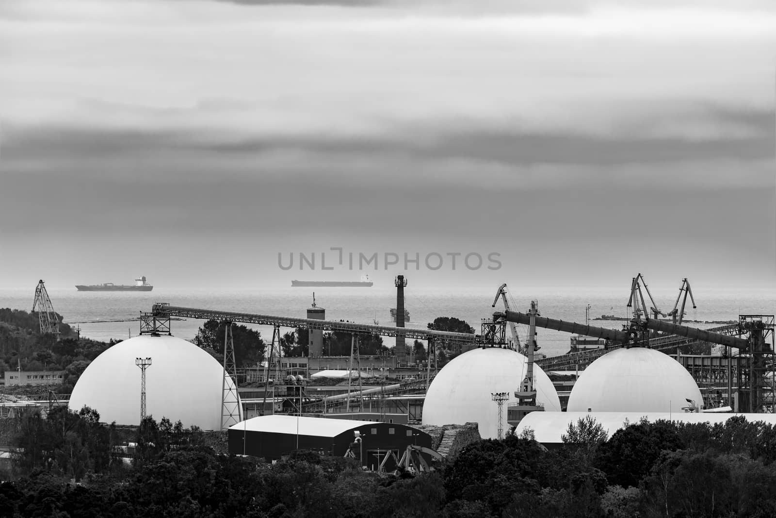 Fuel terminal in Riga, Latvia. Large oil tanks. Monochrome