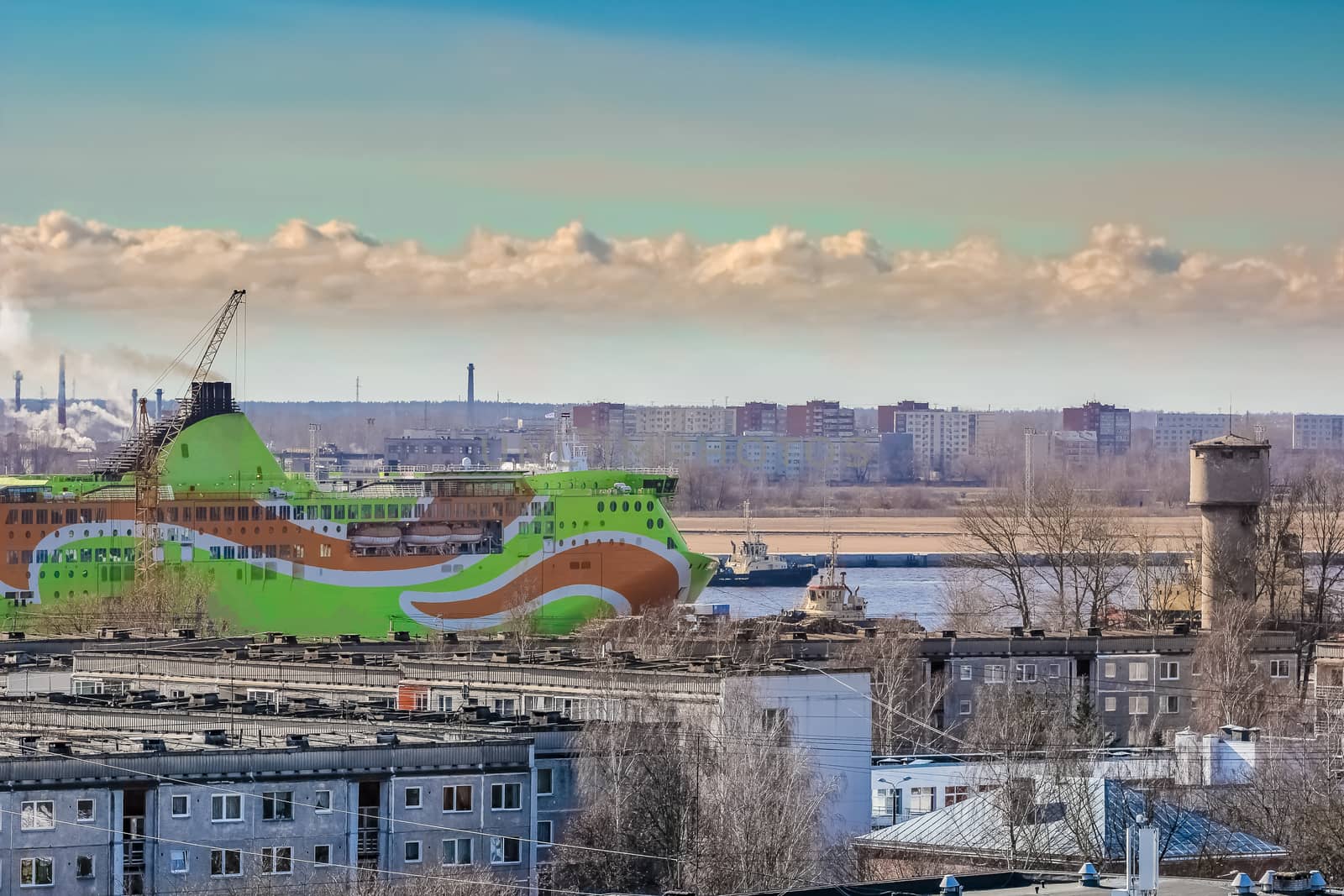 Green cruise liner. Passenger ferry sailing past the Riga city