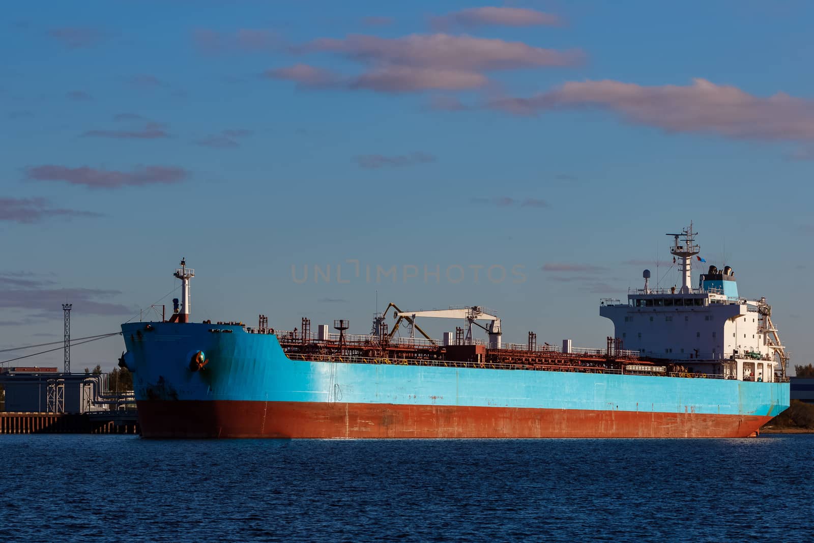 Blue cargo ship loading by sengnsp