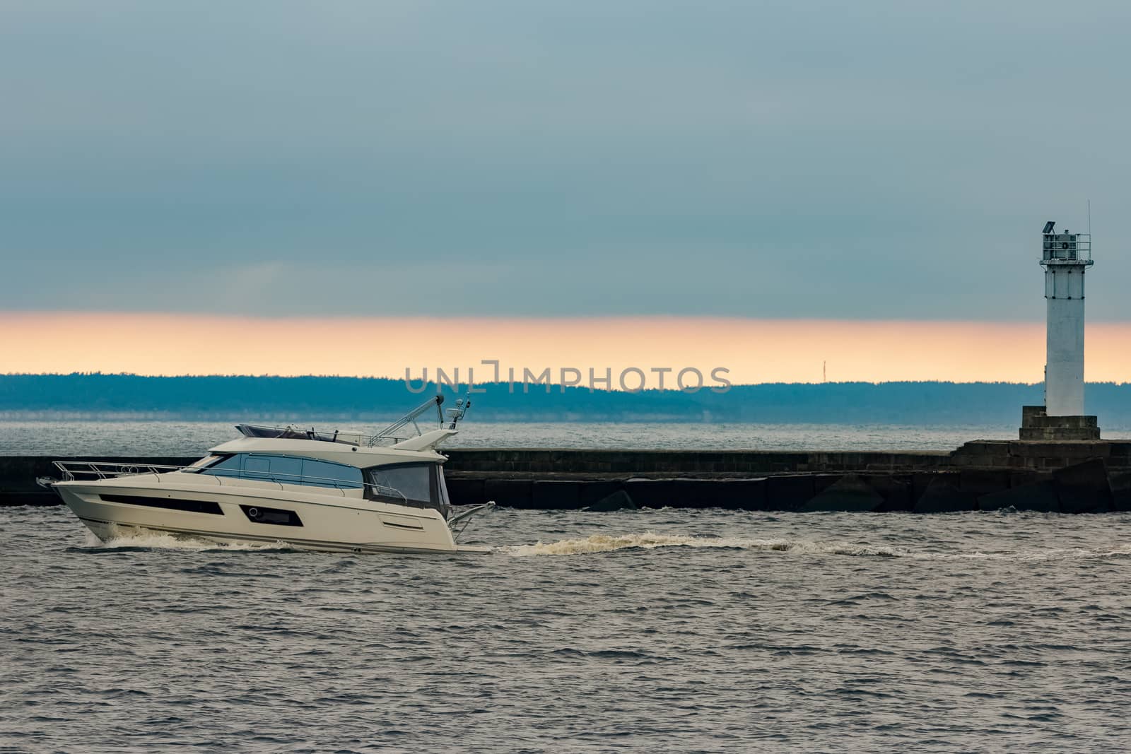 White small speed boat sailing in still water