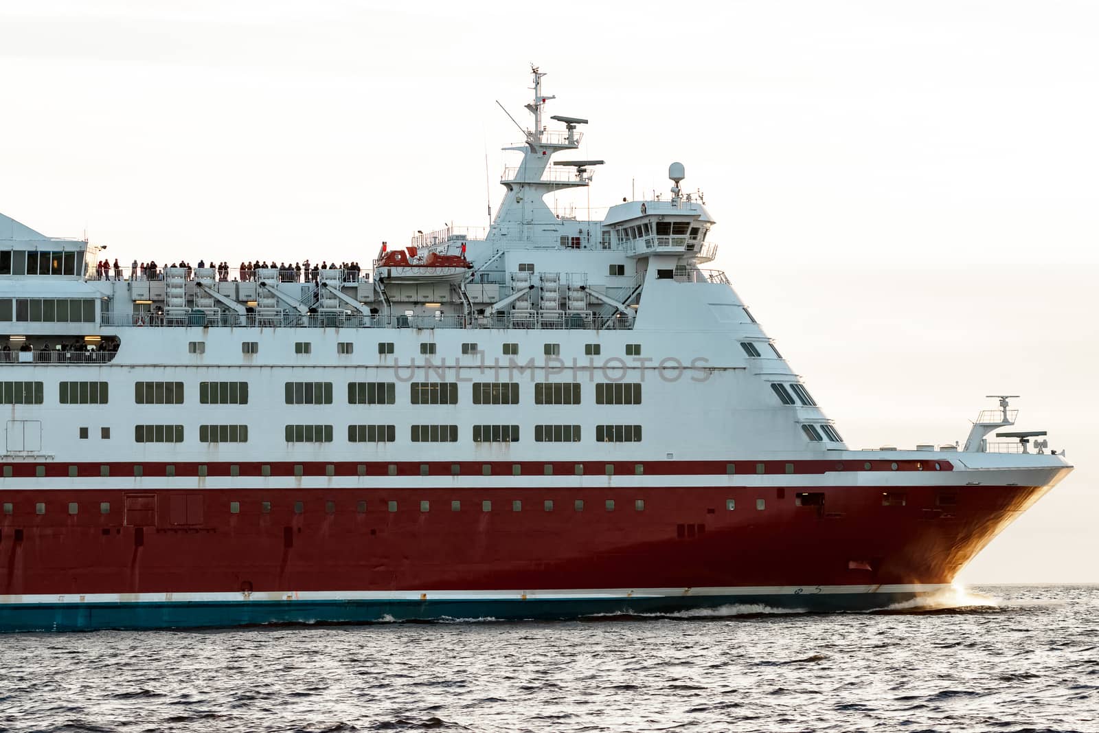 Red cruise liner's bow. Passenger ferry underway