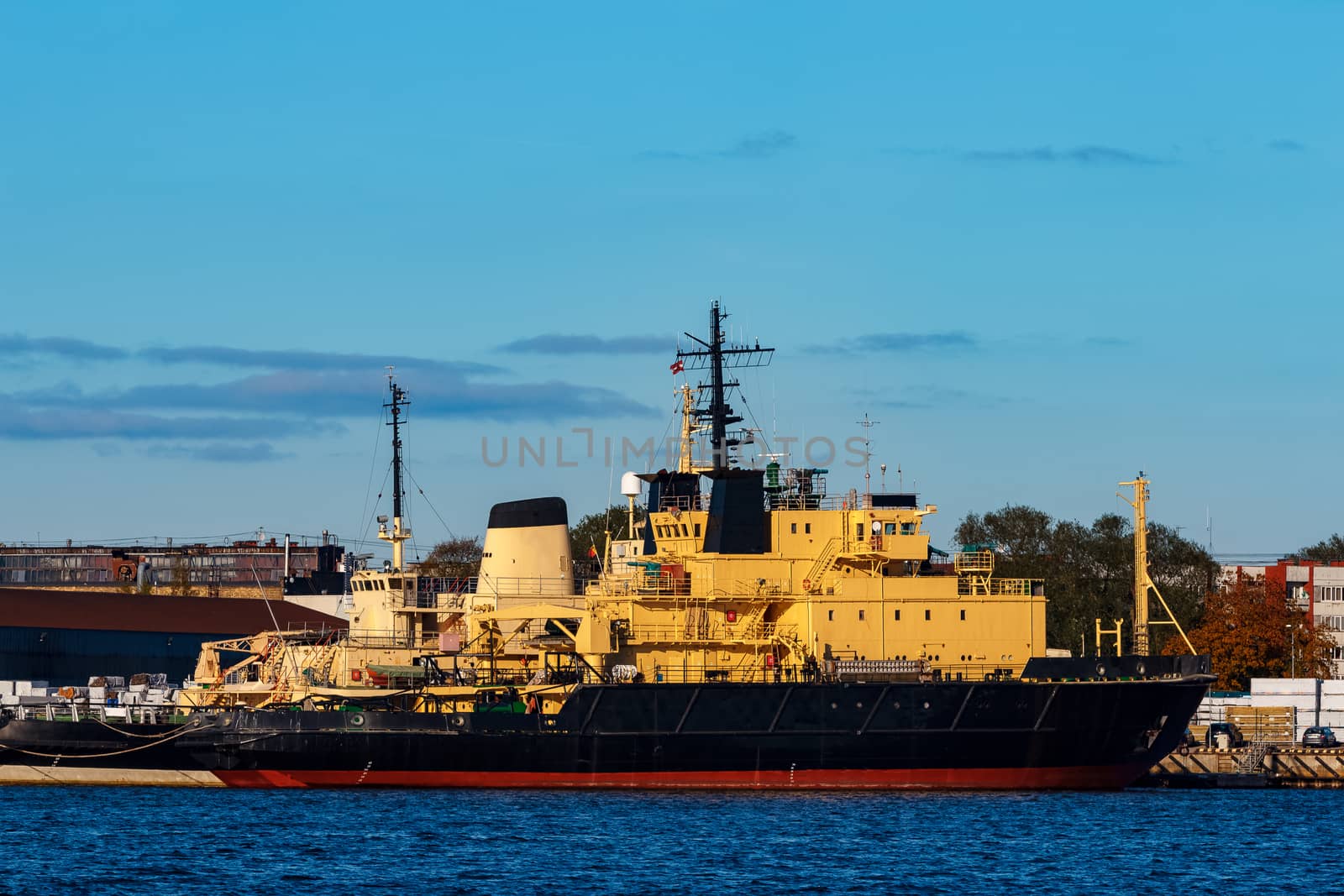 Yellow icebreakers moored at the port of Riga, Europe