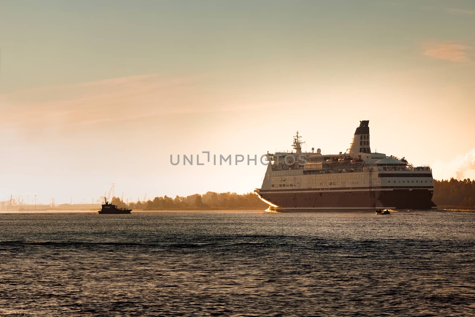 Big cruise liner. Passenger ferry ship entering Riga at morning