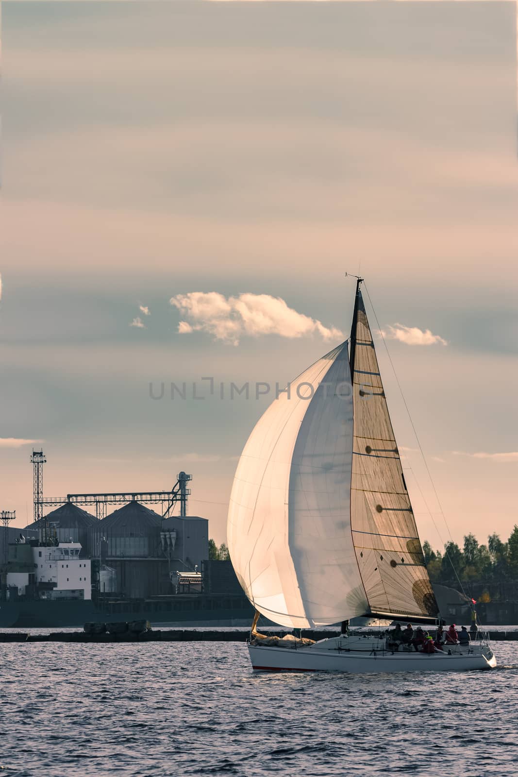 Sailboat moving on Daugava river by sengnsp