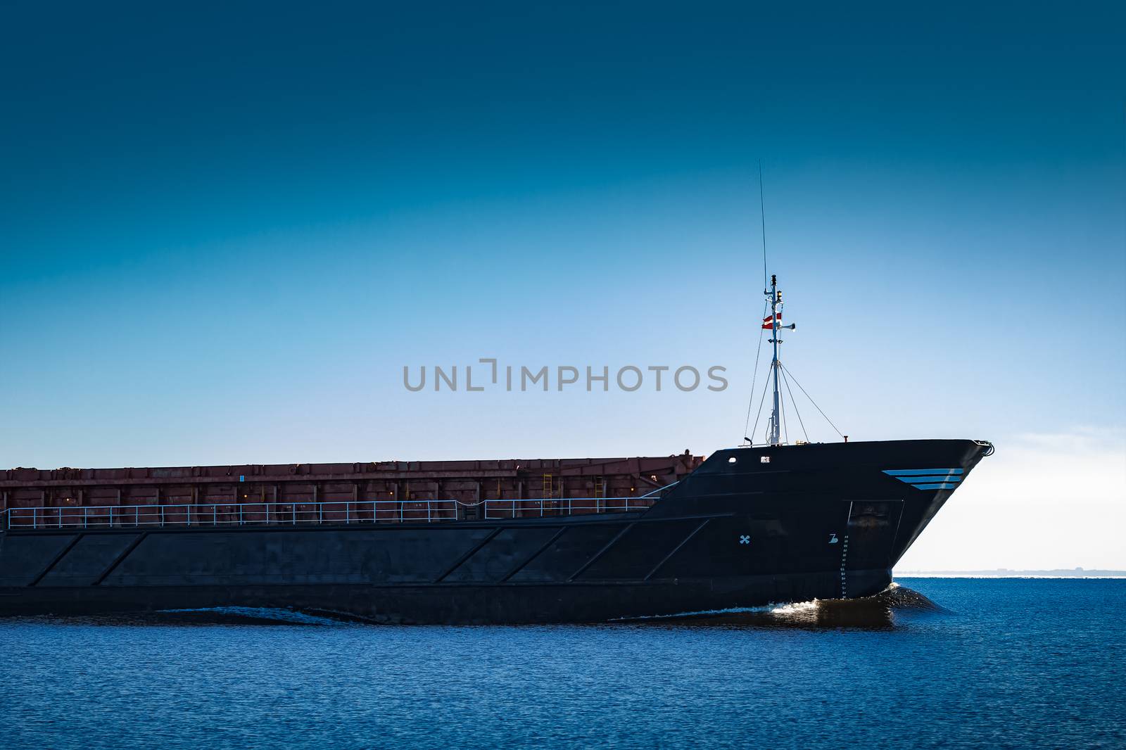 Black cargo ship's bow by sengnsp