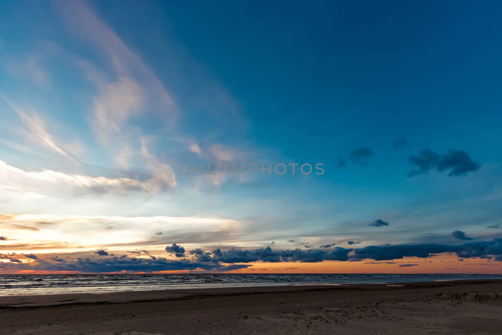 Blue cloudy sky over the Baltic sea at evening