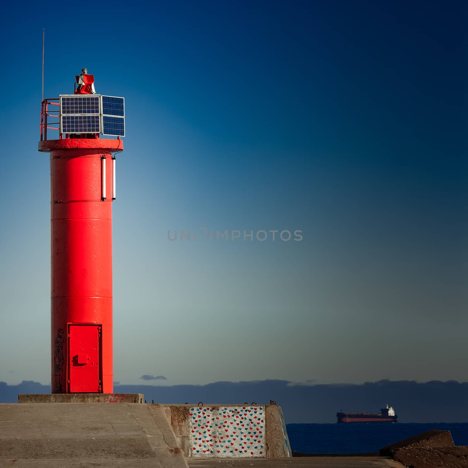 Red lighthouse on breakwater dam in Riga, Europe