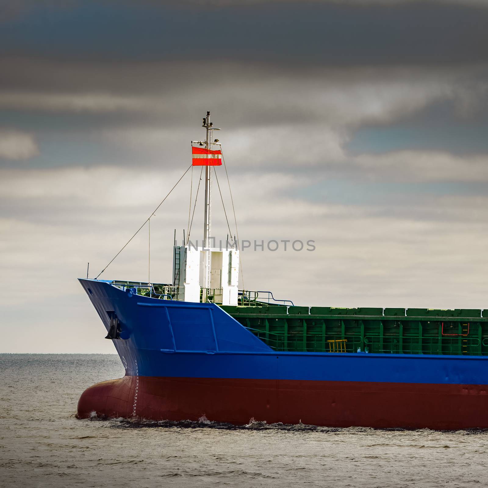 Blue cargo ship's bow by sengnsp