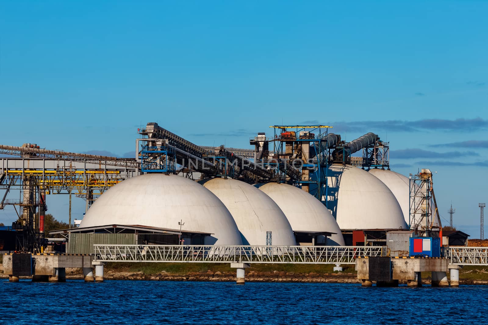 Fertilizer terminal in Riga, big white storage tanks