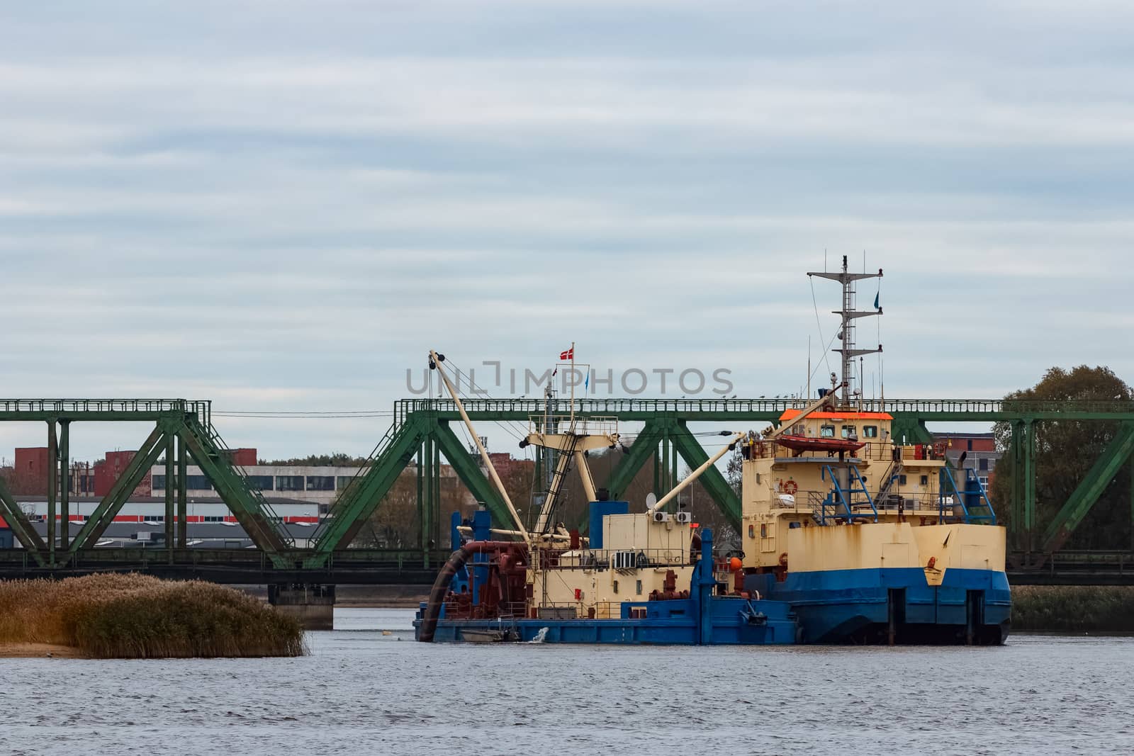Blue cargo ship in the port of Riga, Europe