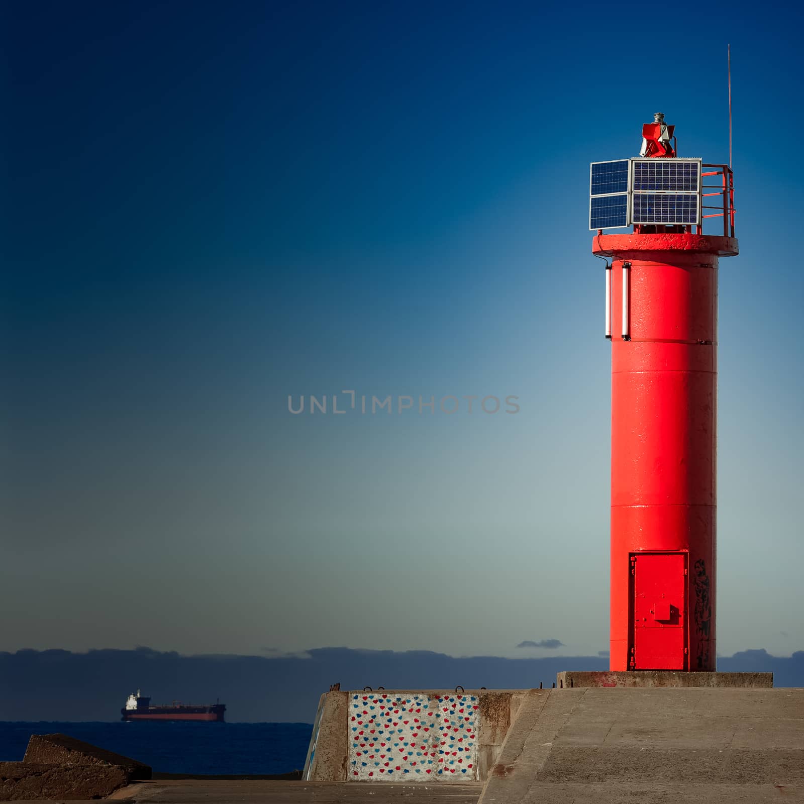 Red lighthouse on breakwater dam in Riga, Europe