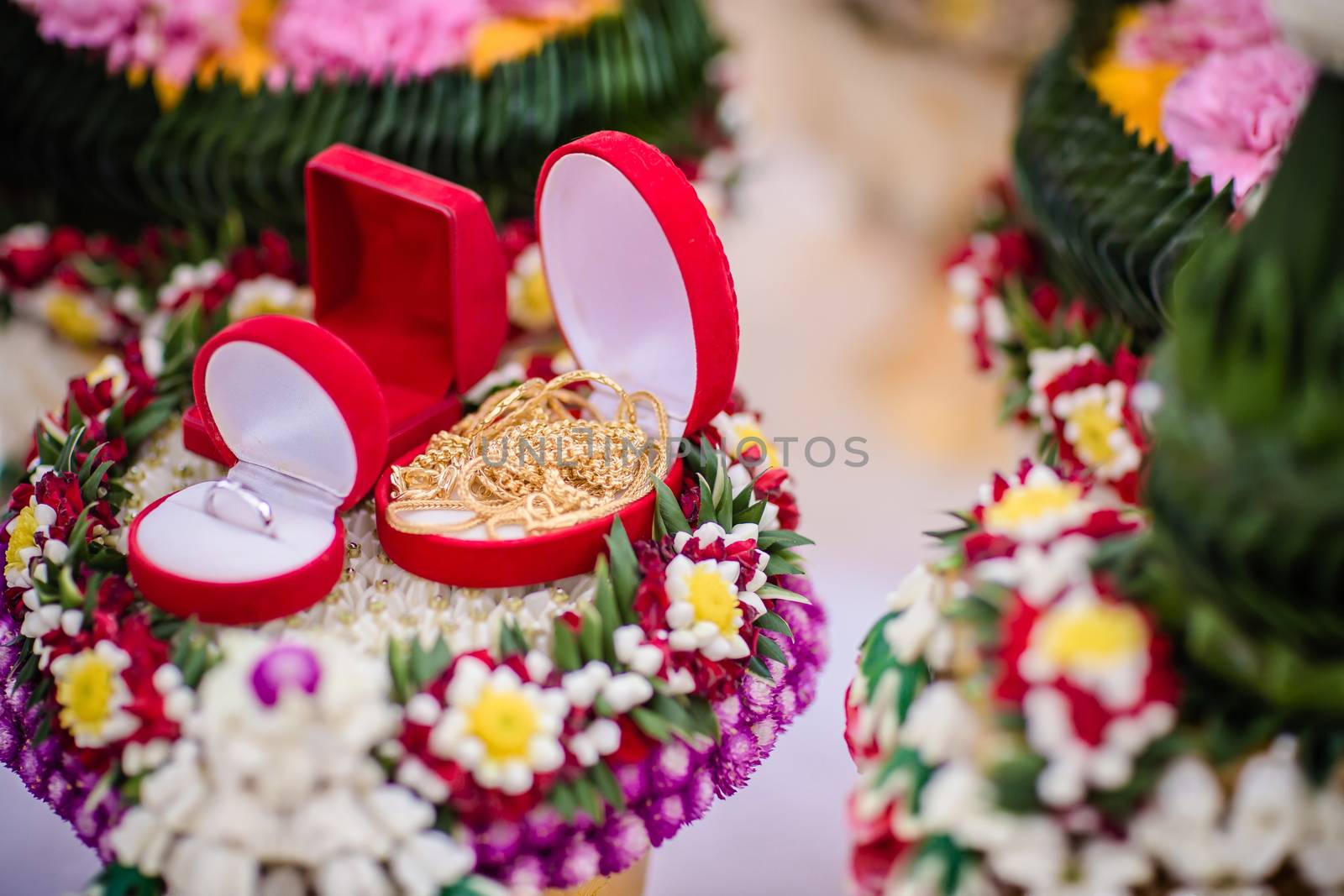 Dowry (gold necklace) on flower tray in Thai traditional wedding