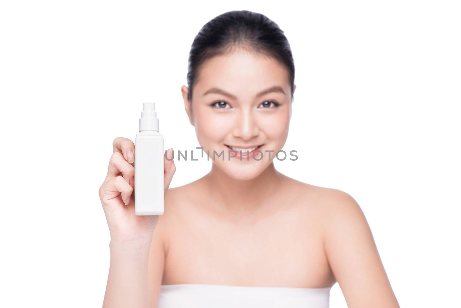 Beautiful asian woman holding spray water bottle isolated white background.