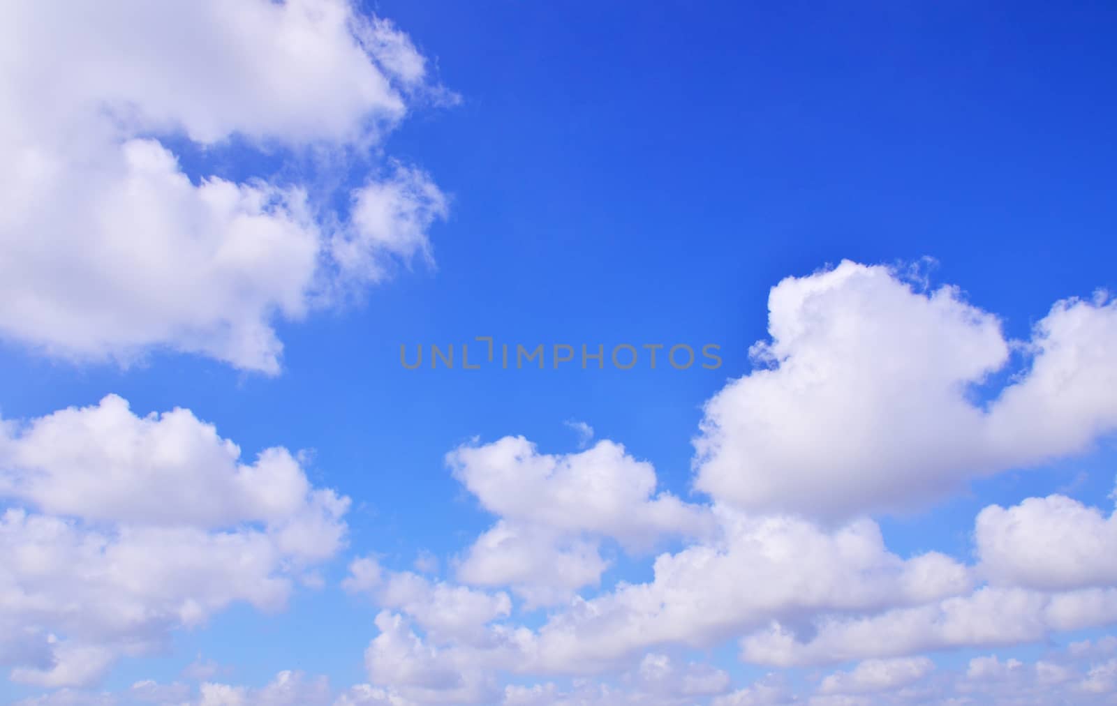 The vast blue sky with clouds