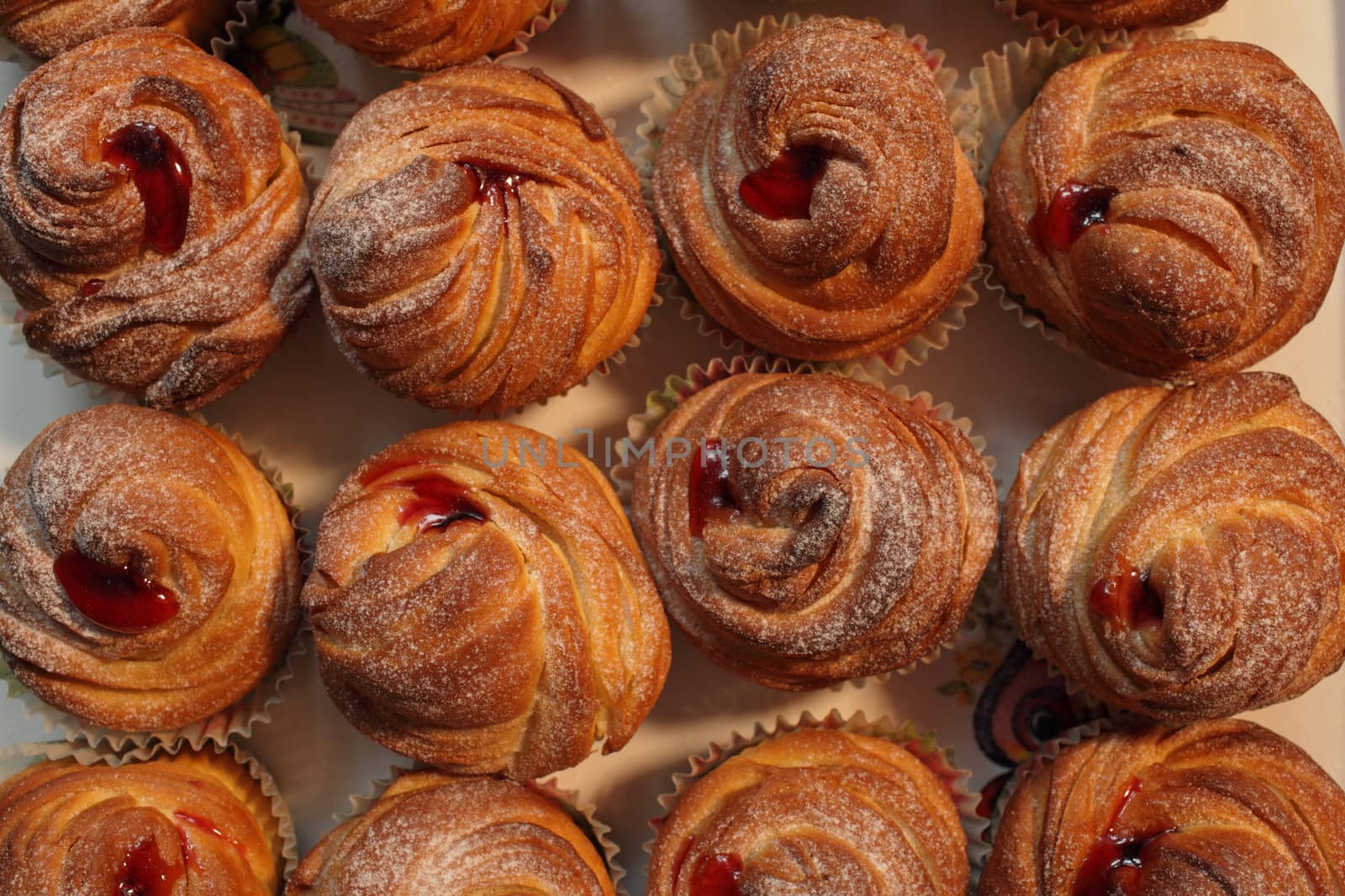 fresh bakery american cruffins with jam Sprinkled with powdered sugar 