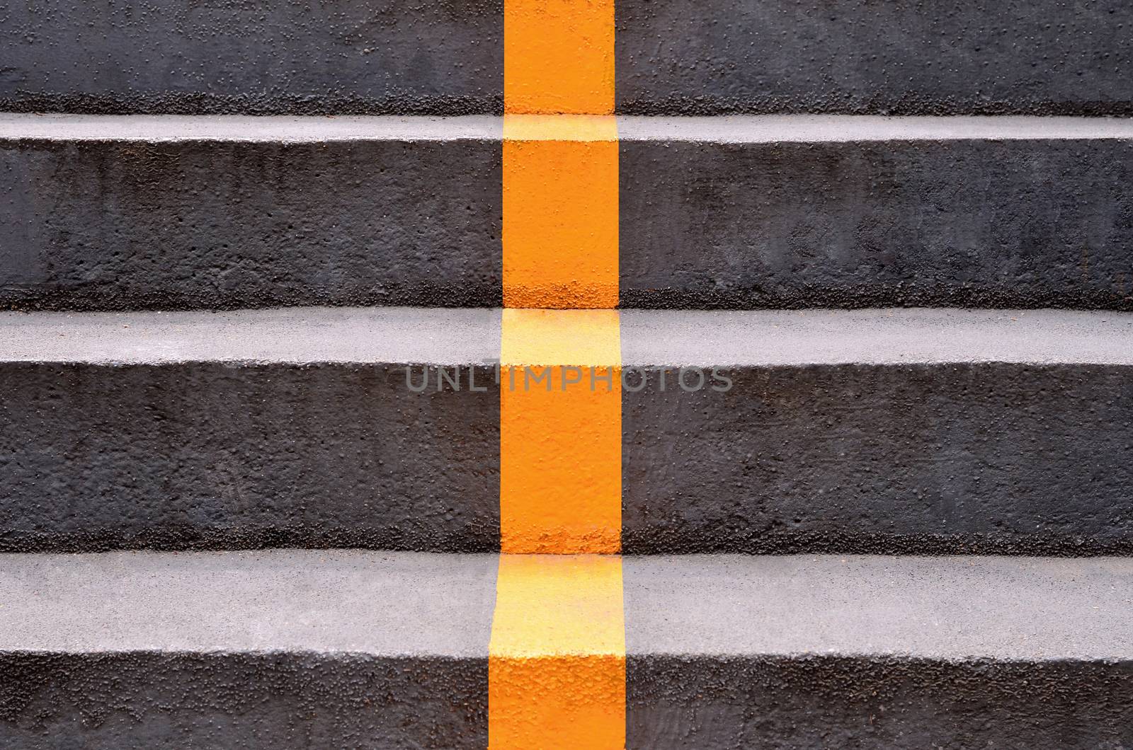 concrete stairs with yellow lines by phochi