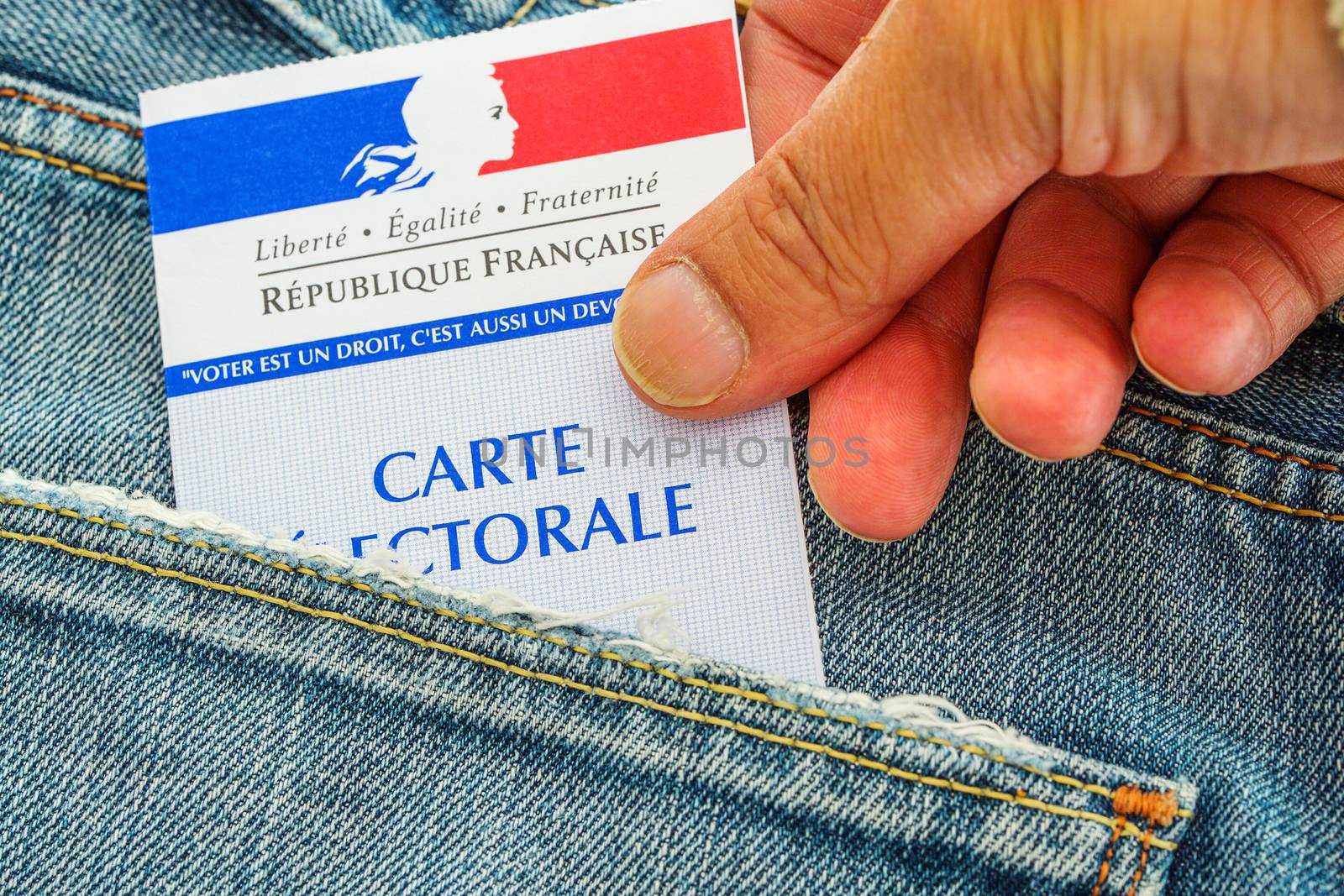 French electoral card out of the pocket of a jeans, 2017 presidential and legislative elections concept by pixinoo