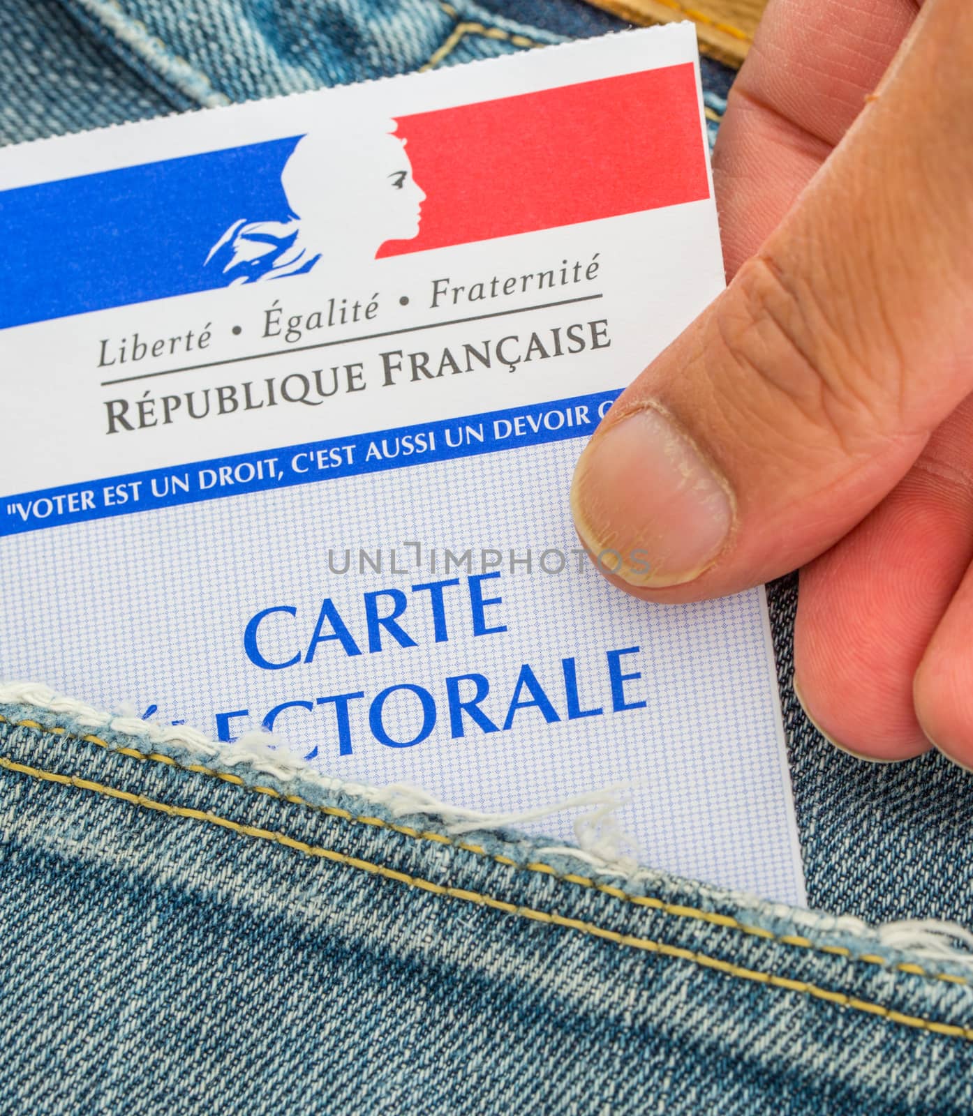 French electoral card out of the pocket of a jeans, 2017 presidential and legislative elections concept by pixinoo