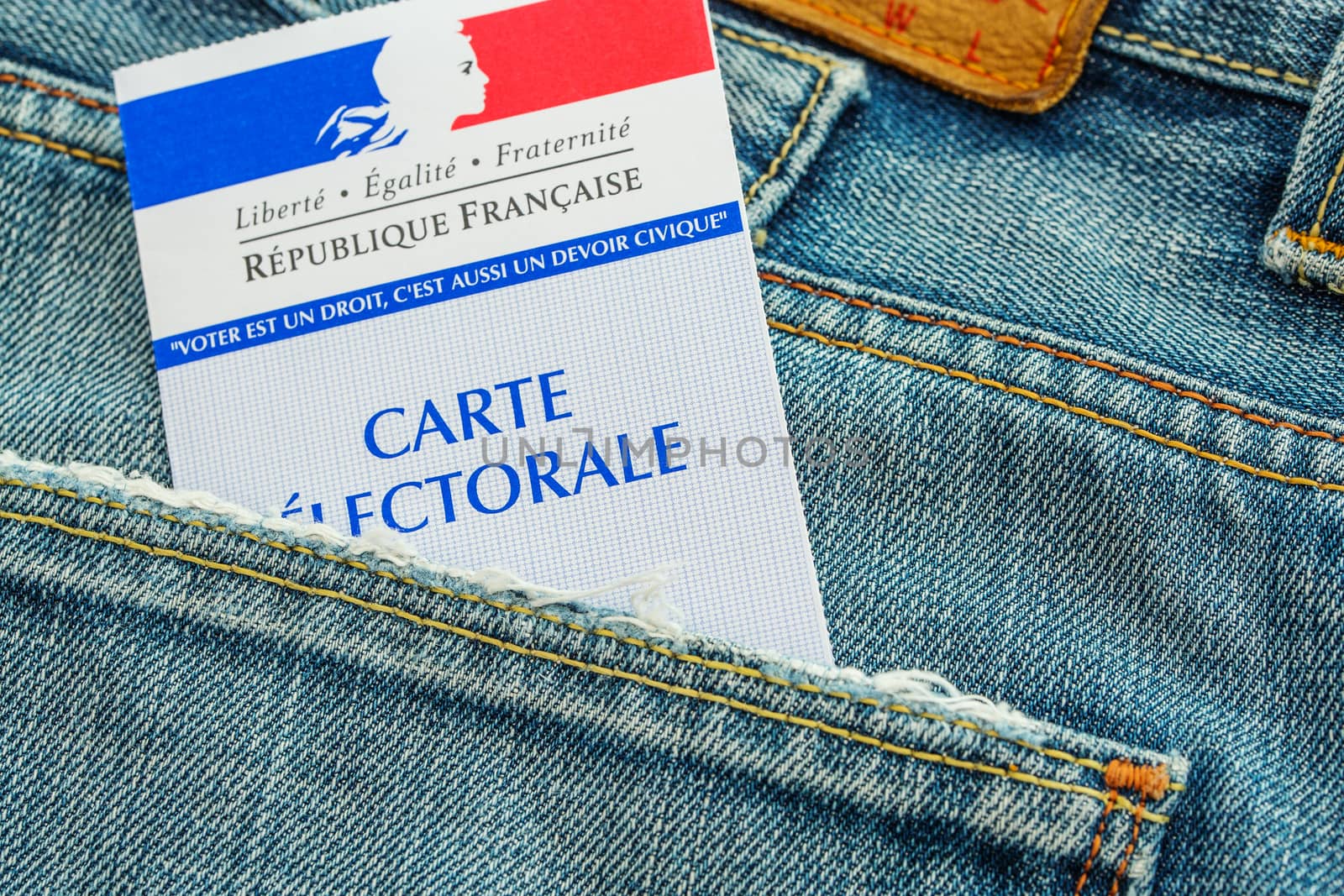 French electoral card in the rear pocket of a jeans, 2017 presidential and legislative elections concept by pixinoo
