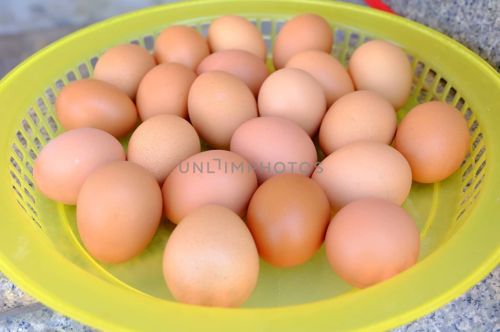 Eggs in Yellow Plastic Tray.