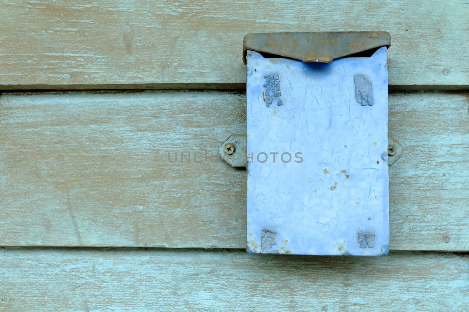 Old Metal Box on Wood Wall Background.